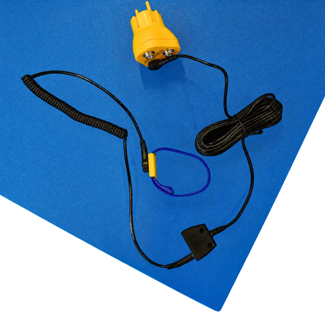 M3 ESD bench mat kit contents laid on the blue mat: wrist strap, coiled cord, earth bonding plug and grounding lead. Accessories ship with the Kit sizes only
