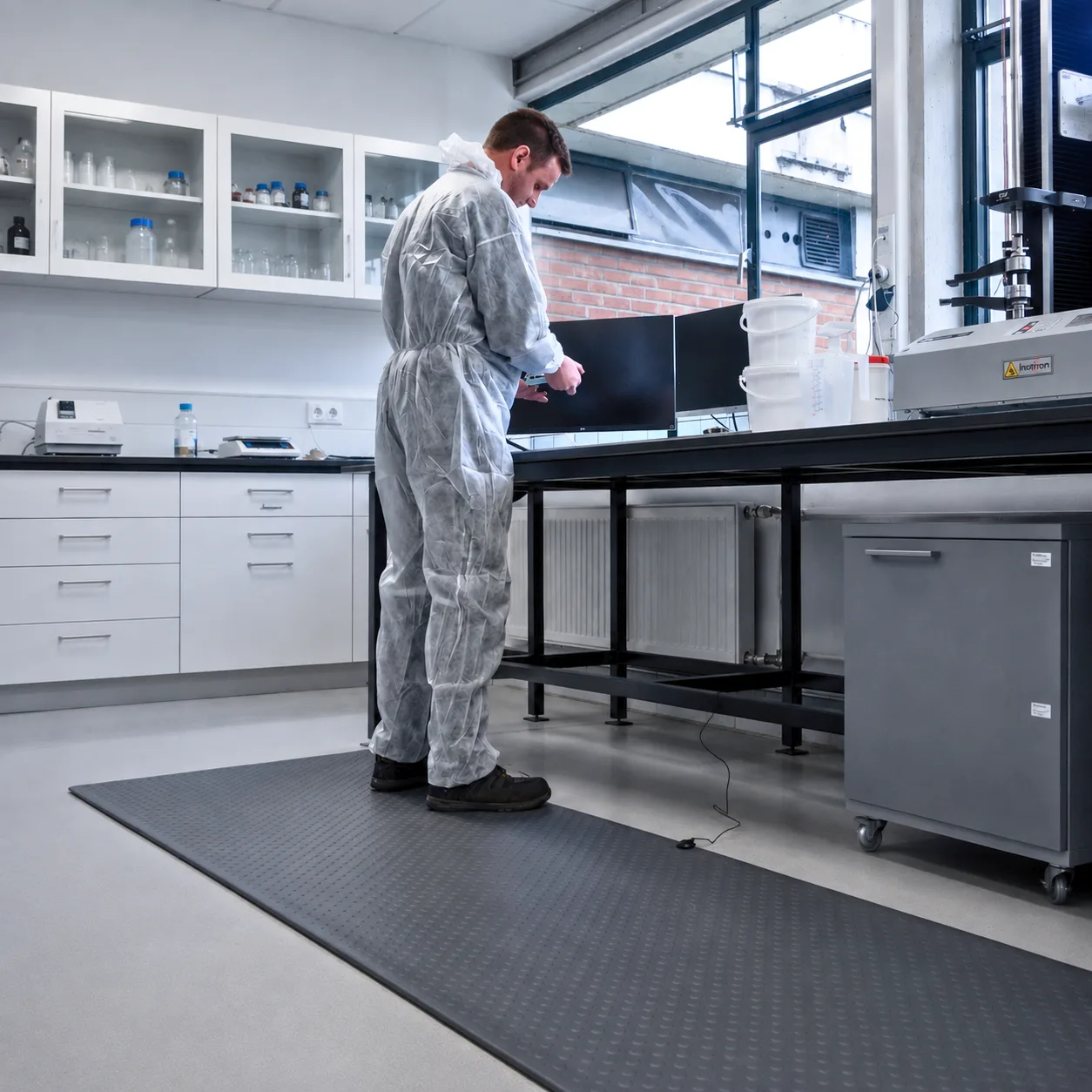 Maximum Matting M4 Series ESD anti-fatigue floor mat at a laboratory bench